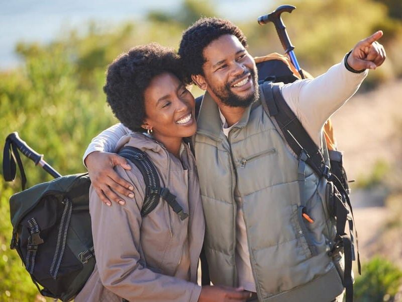 black-couple-happy-pointing-hike-adventure-outdoor-exploration-sightseeing-journey-happiness-love-care-people-trekking-with-backpack-together-with-excited-smile-travel_590464-154052