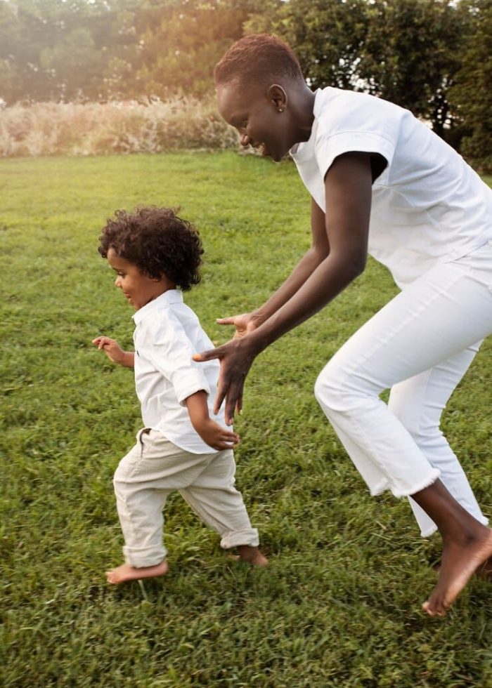 full-shot-mother-kid-running-outdoors_23-2149602803